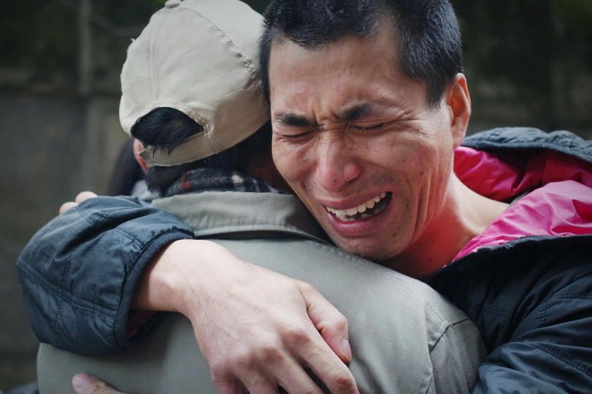 Năm 2013, tử tù Wu Changlong (phải) được trả tự do sau 12 năm ngồi tù chờ thi hành án tử vì bị kết tội khủng bố. Nguồn ảnh: caixin.com