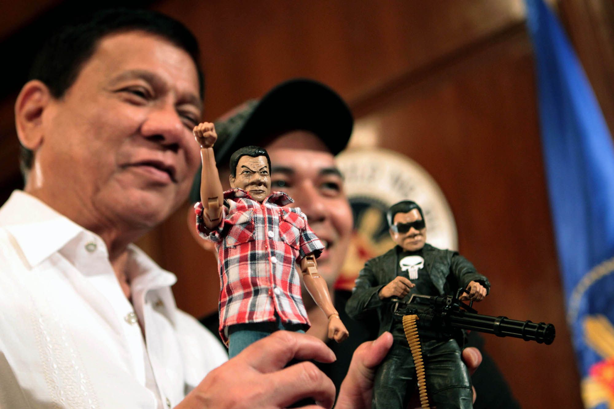 THE SIMPLE AND THE PUNISHER. President Rodrigo R. Duterte poses with toy maker Dennis Mendoza while showing two custom-made action figures of himself. One shows the simple Duterte who is often seen wearing a checkered polo and denim jeans while the other shows the resemblance of the cartoon character 'The Punisher' as he has been known to have an iron fist approach in addressing criminalities. ROBINSON NIÑAL/PPD